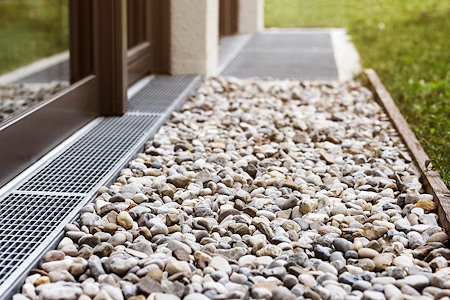 Drainage Solutions for Sloped Yards in New Hampshire: What Actually Works